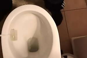 Uncaring man pees in toilet