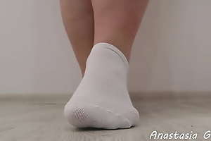 Big feet in white socks
