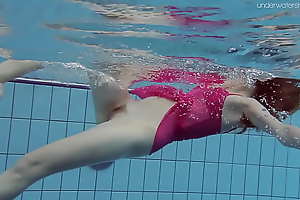 Anna Netrebko swims in left side lingerie in the pool